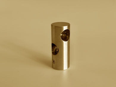 Type B solid brass shelf fitting with three pipe connection points, shown in a polished brass finish.