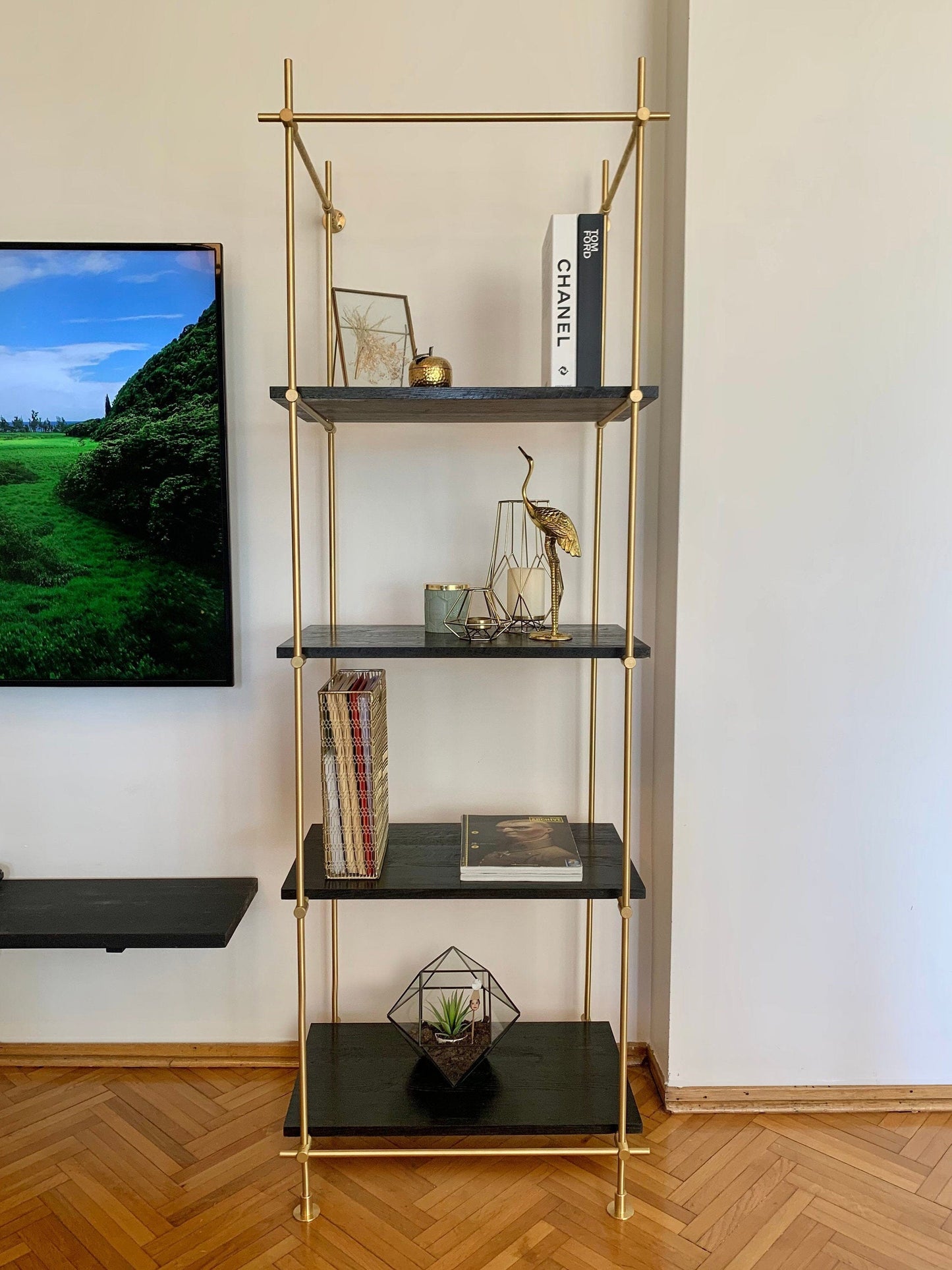 Gold bookcase and gold shelving unit. Harmony of unlacquered brass and dark oiled oak. Reflect luxury in your decoration. Shelving Brassshelf