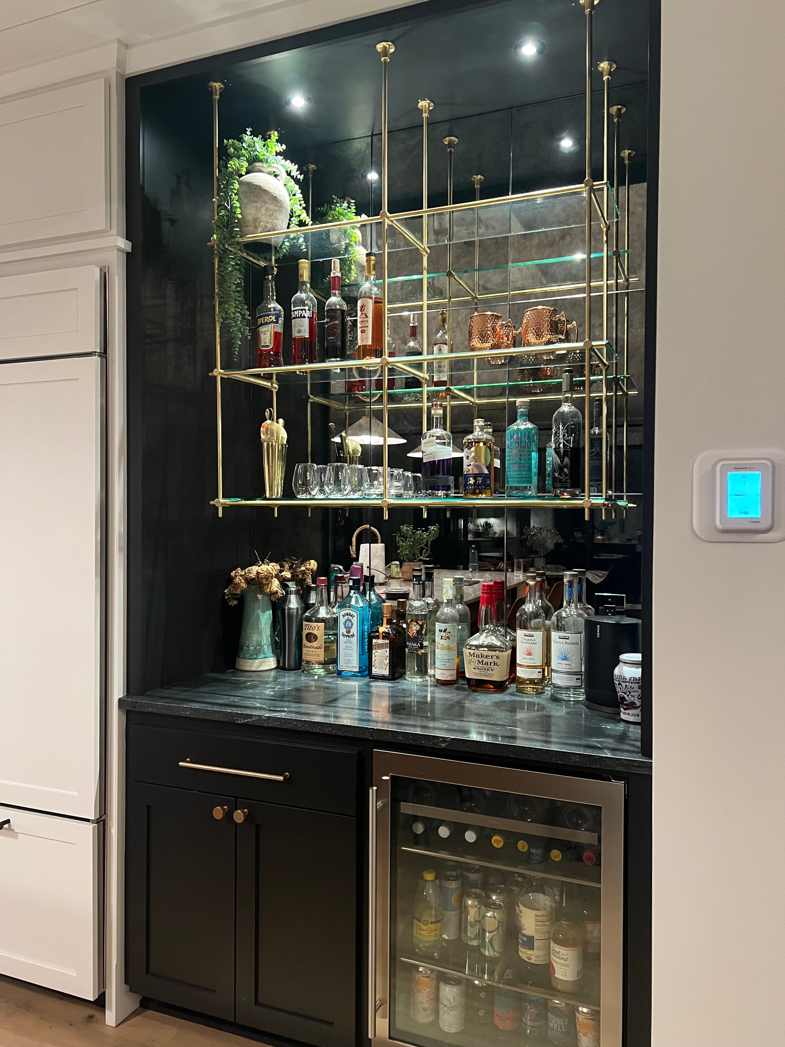 Elegant brass bar shelving system for modern homes - Beautifully designed elegant brass bar shelving system that complements modern home interiors and enhances your bar area.