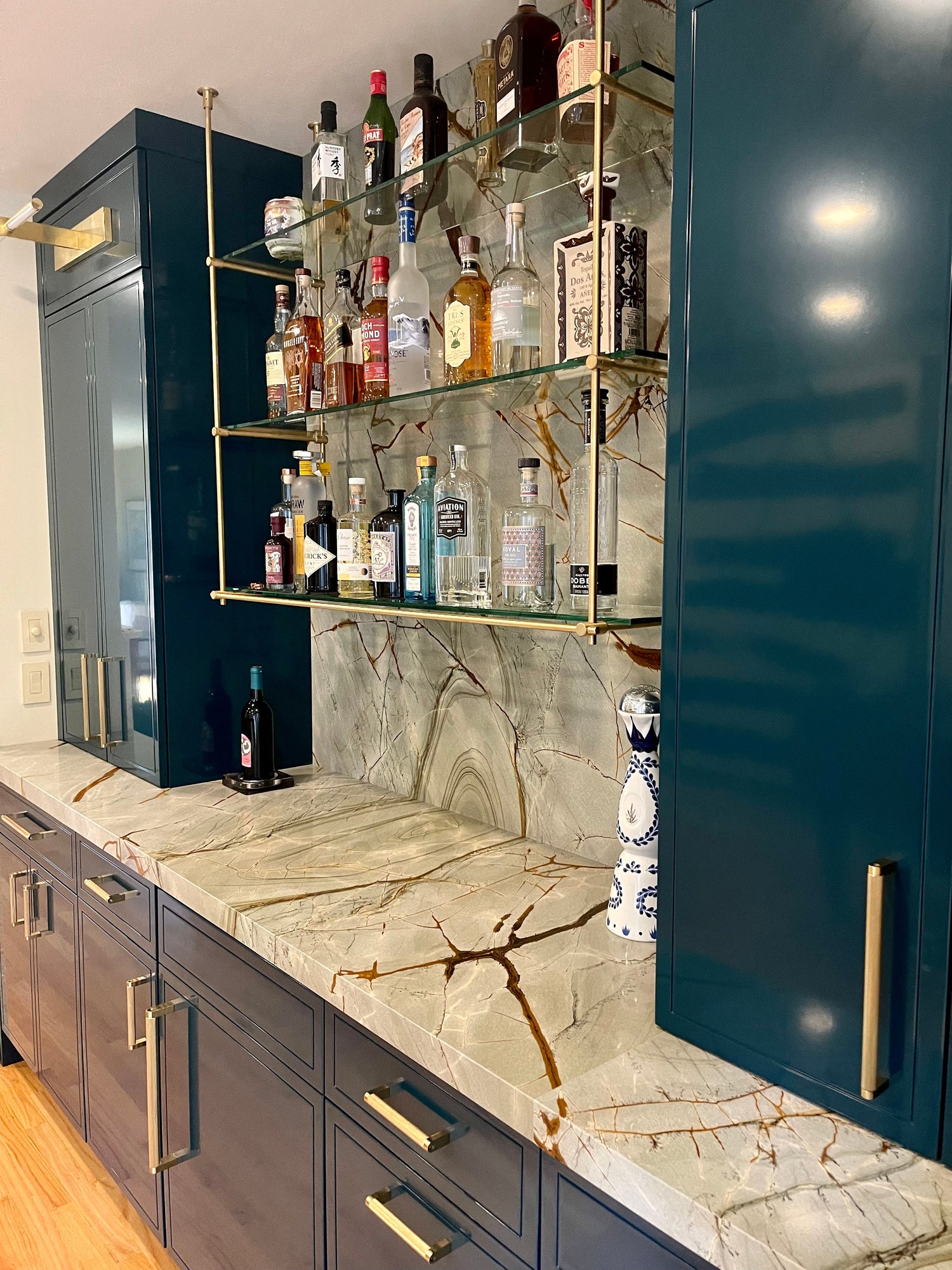 Custom ceiling and wall mounted solid brass residential wet bar shelving, brushed brass, Los Angeles, CA