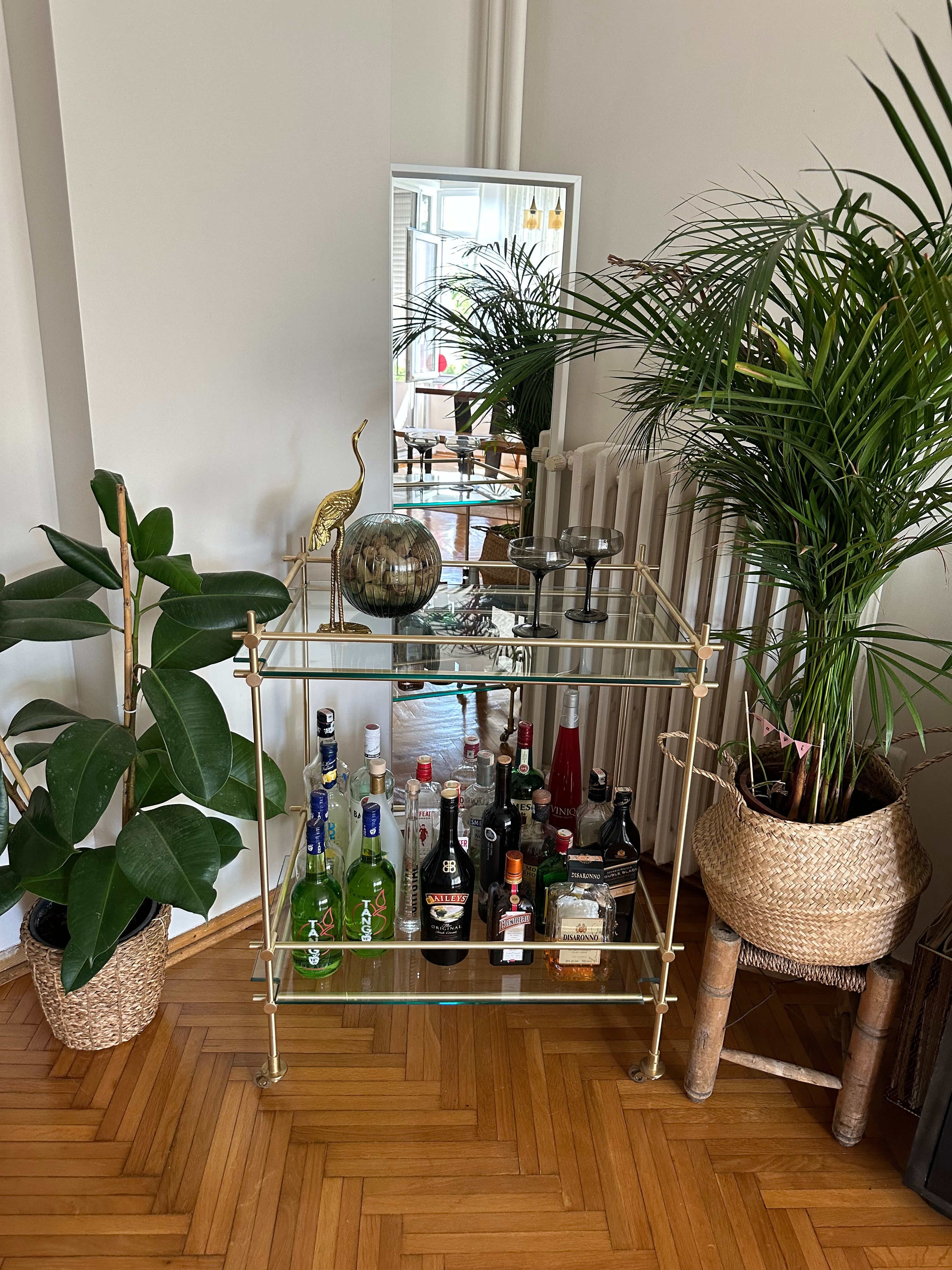 Custom brass bar shelving with glass shelves - Stylish and durable custom brass bar shelving featuring sleek glass shelves, ideal for a sophisticated home bar setup.