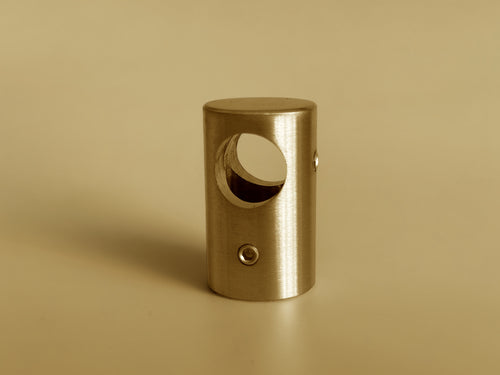 Sleek Type A solid brass shelf fitting in a brushed/satin finish, connecting two brass pipes.